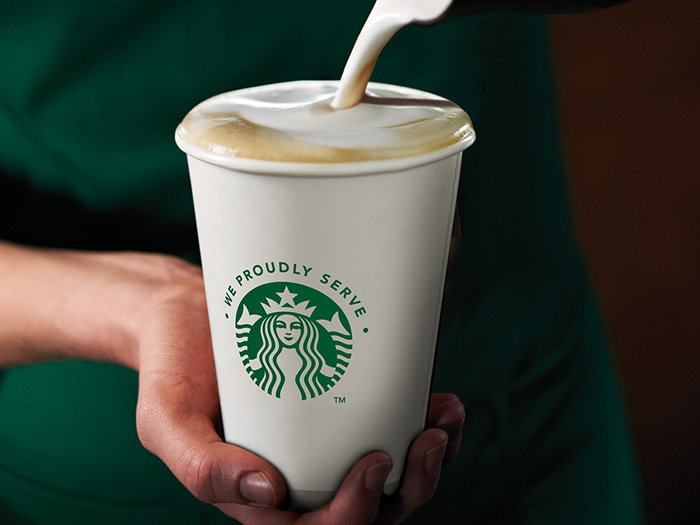 Starbucks cup milk pouring